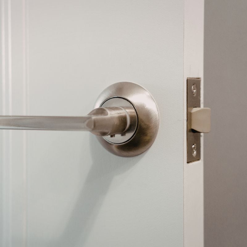 Brushed nickel lever door handle and latch detail installed by Oxland Builders