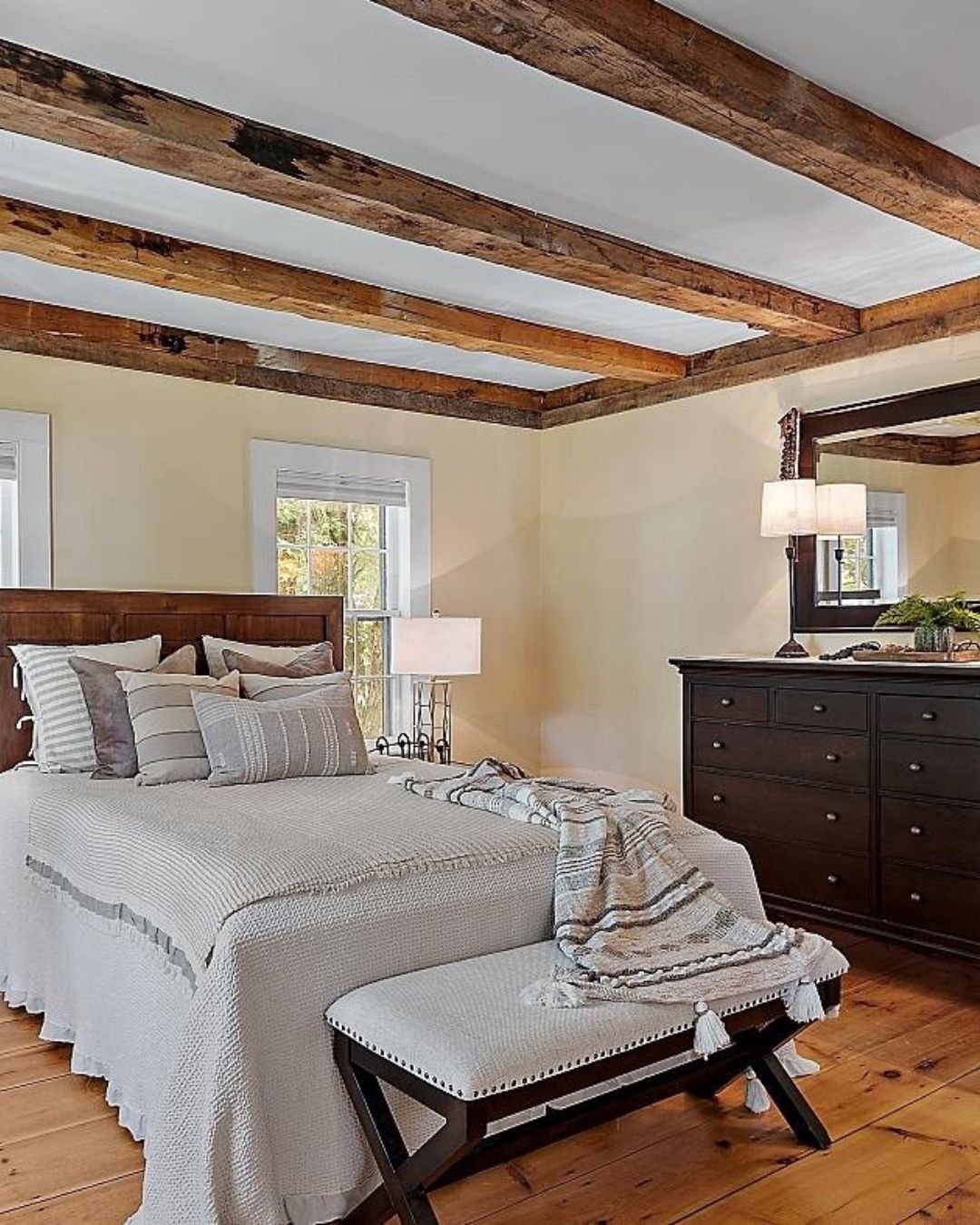 Farmhouse style bedroom renovation in Rockingham County with wood beam ceilings-1