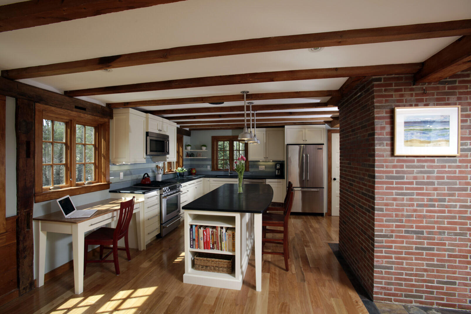 Rustic kitchen with exposed wood beams and brick accents, remodeled by Oxland Builders in New Hampshire Rustic kitchen with exposed wood beams and brick accents, remodeled by Oxland Builders in New Hampshire