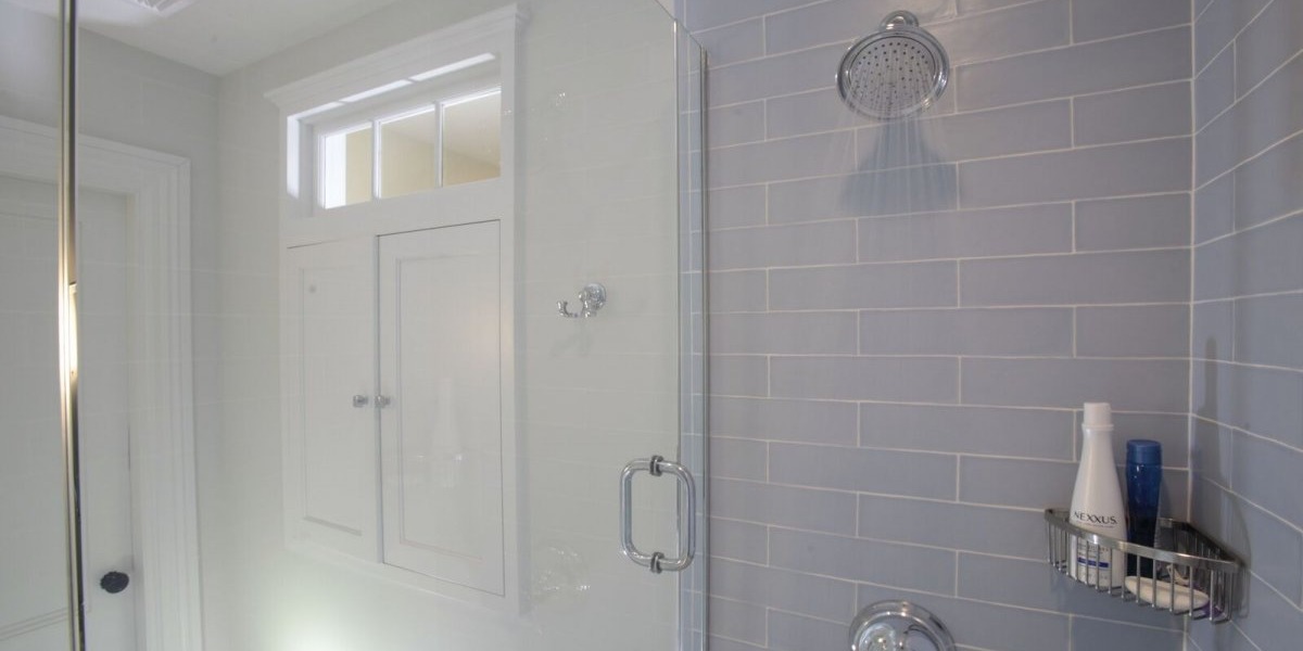 Bathroom shower head with subway tiling in walk-in shower