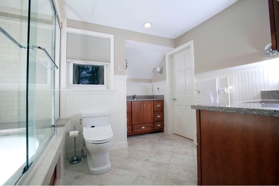 Sea Coast, NH area bathroom with glass shower, wood vanity, tile floor, and modern fixtures