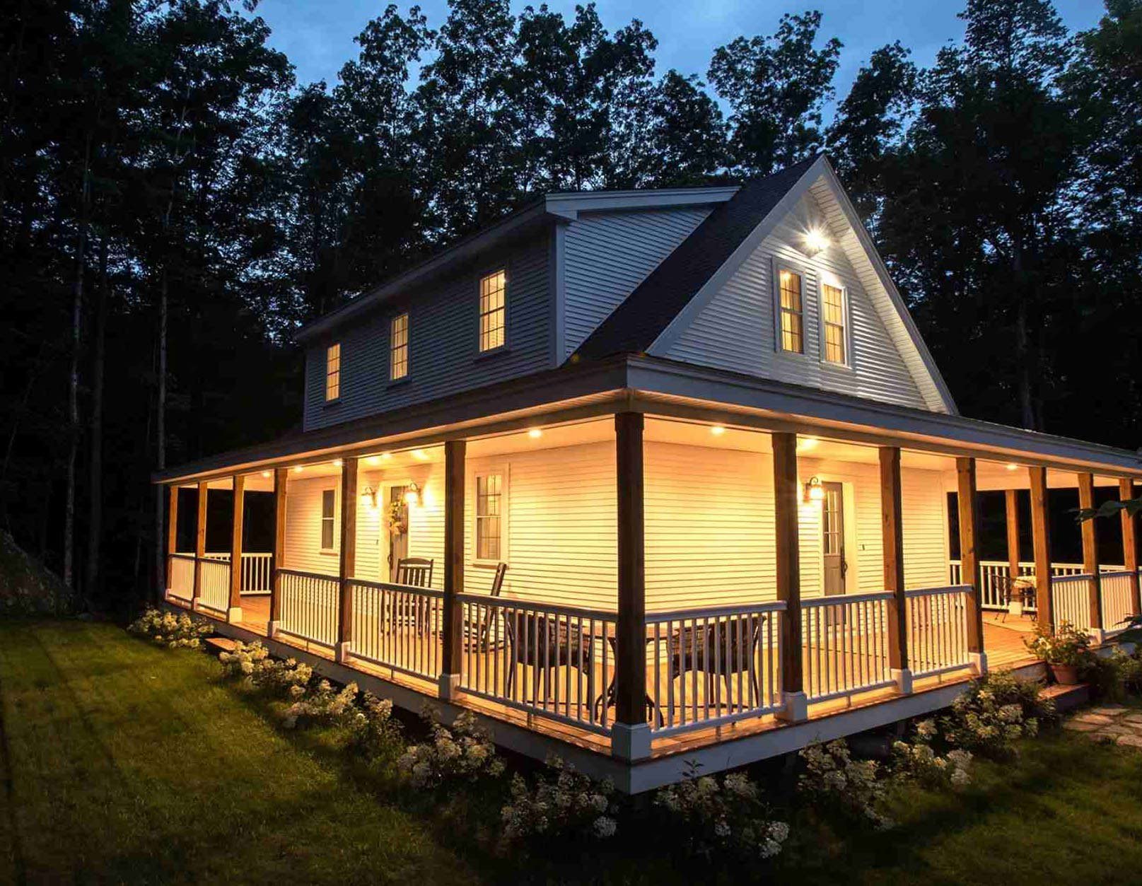 Wrap around porch with lighting on home