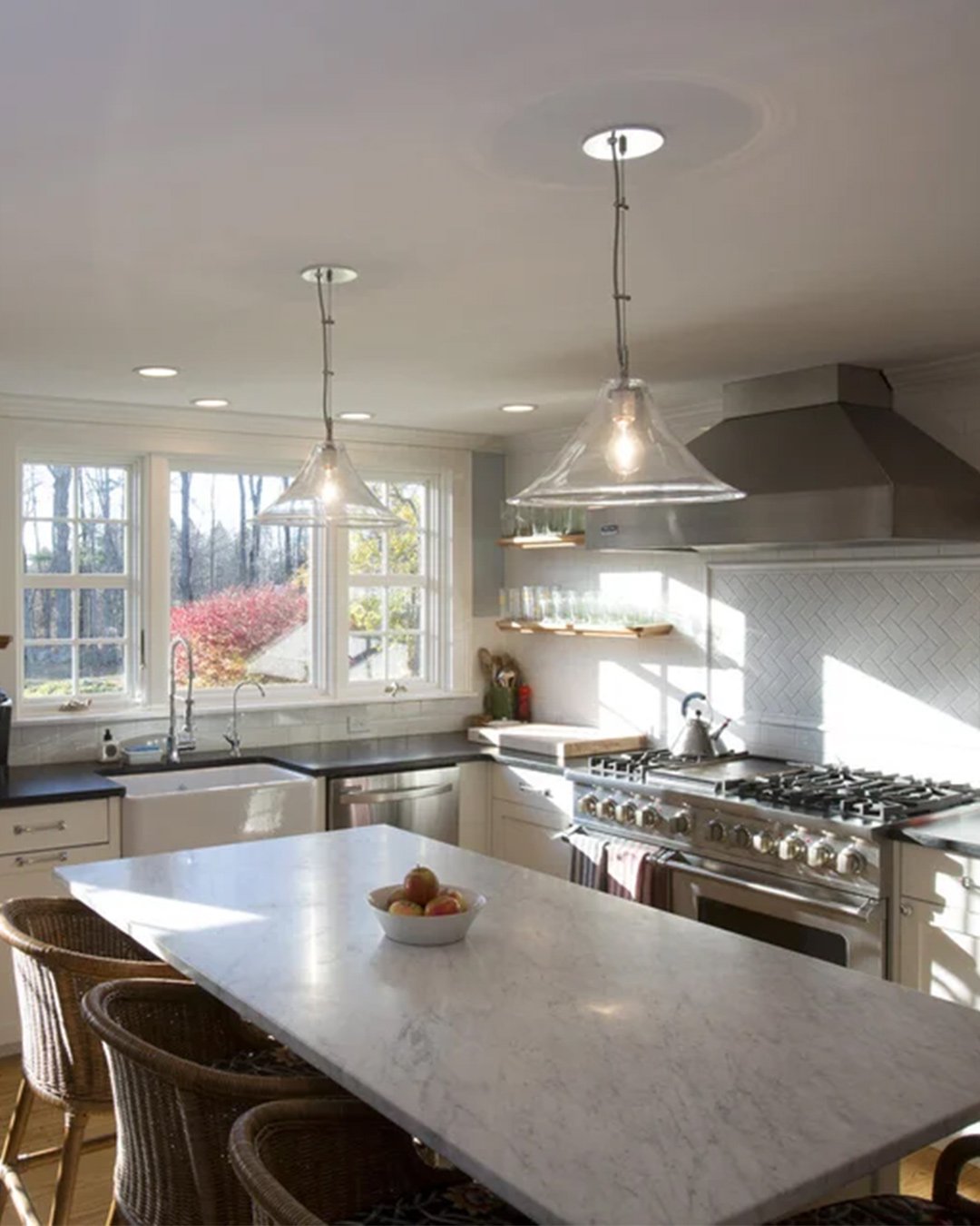 Bright and modern kitchen remodel in New Hampshire by Oxland Builders featuring an island and stainless steel appliances-2