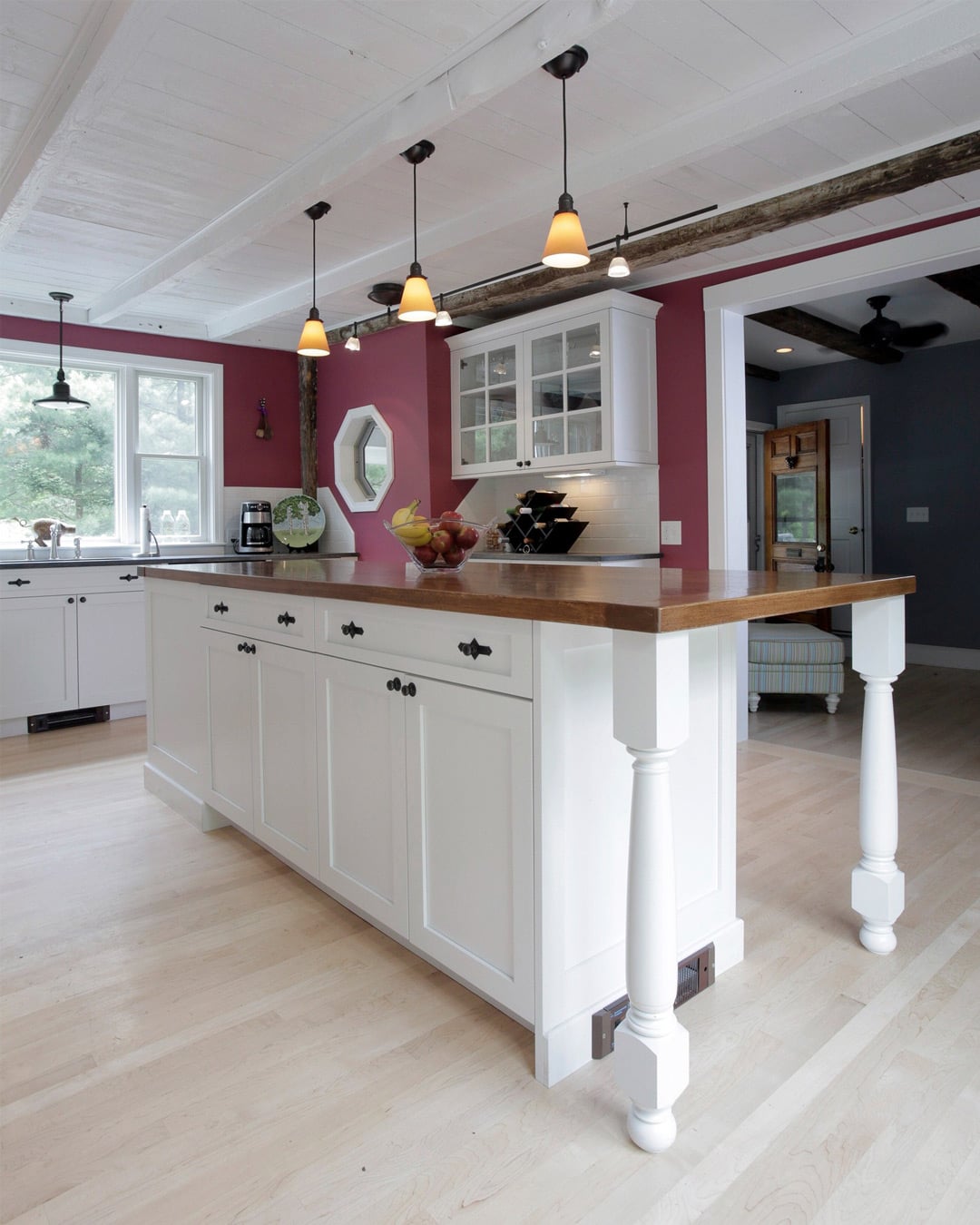 Butcher block island in kitchen remodel with white shaker cabinets in New Hampshire-1