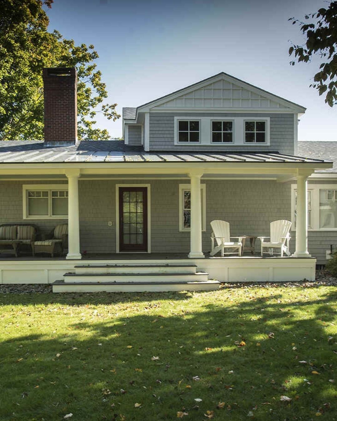 Coastal-style home with a covered porch and classic architectural details, built by Oxland Builders in New Hampshire-2