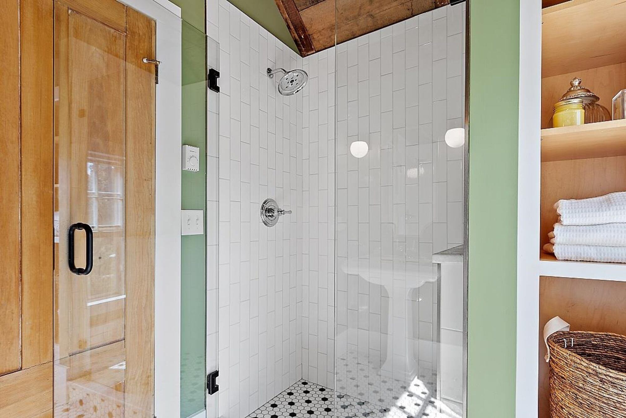 Small bathroom with unique wallpaper and vintage-style fixtures, designed by Oxland Builders in New Hampshire Small bathroom with unique wallpaper and vintage-style fixtures, designed by Oxland Builders in New Hampshire