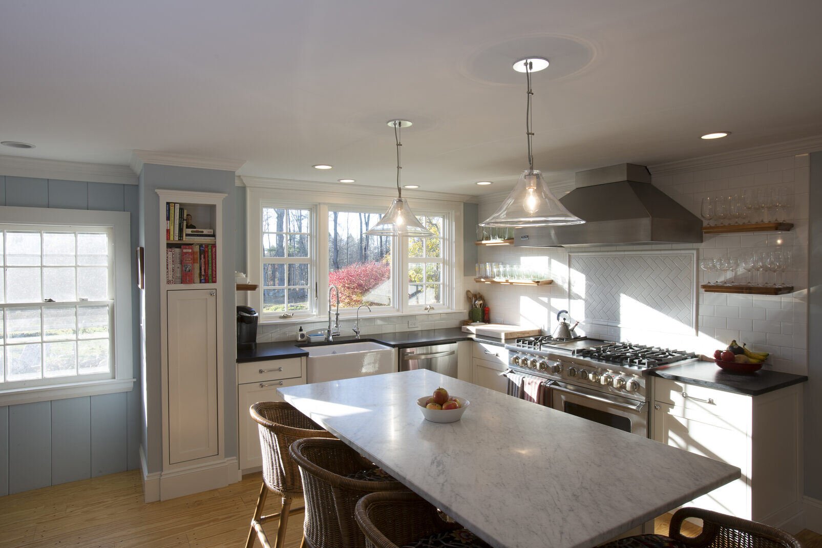 Modern kitchen remodel by Oxland Builders in New Hampshire featuring ample natural light and a clean design aesthetic