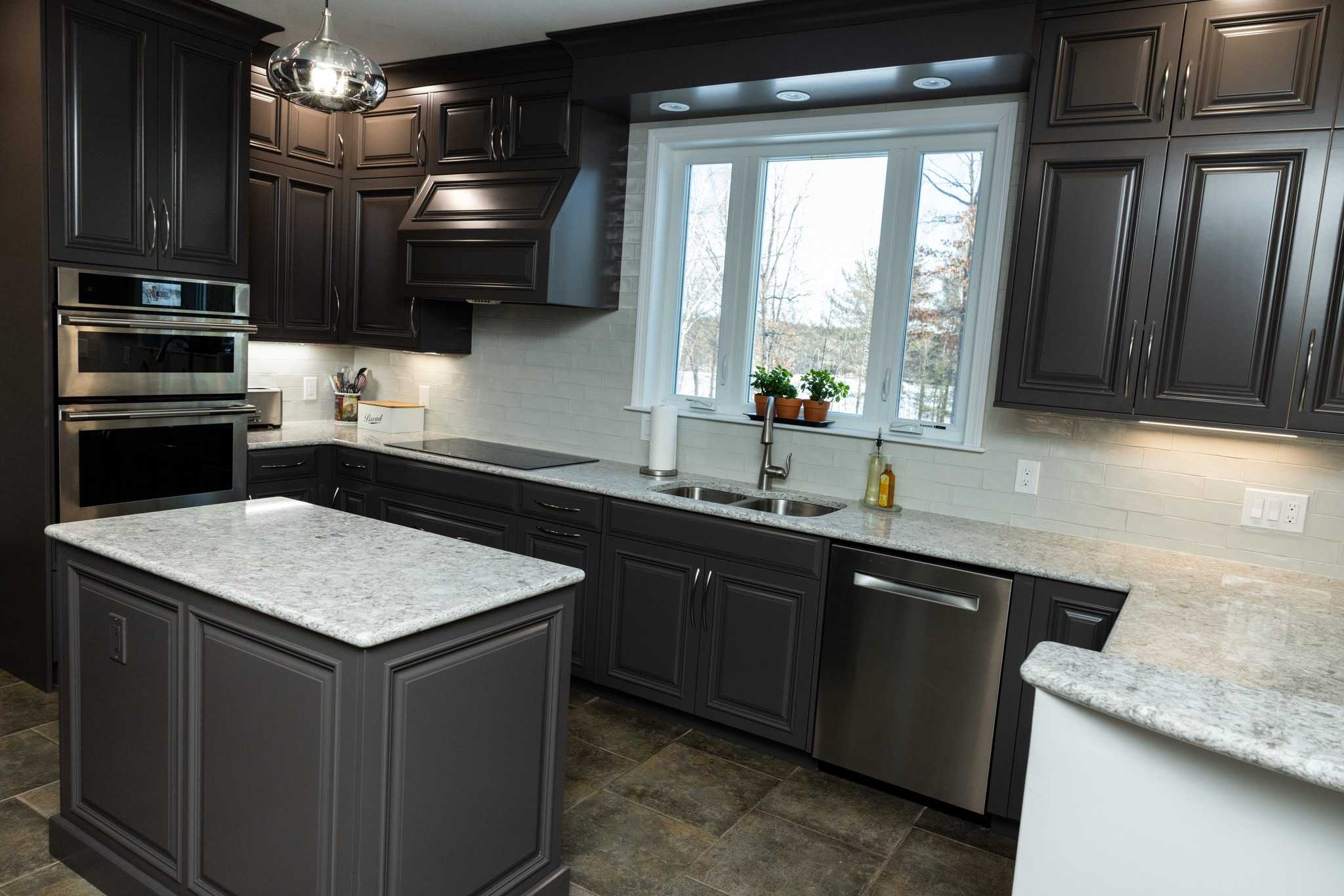 New Hampshire kitchen remodel with white subway tile and dark gray shaker cabinets