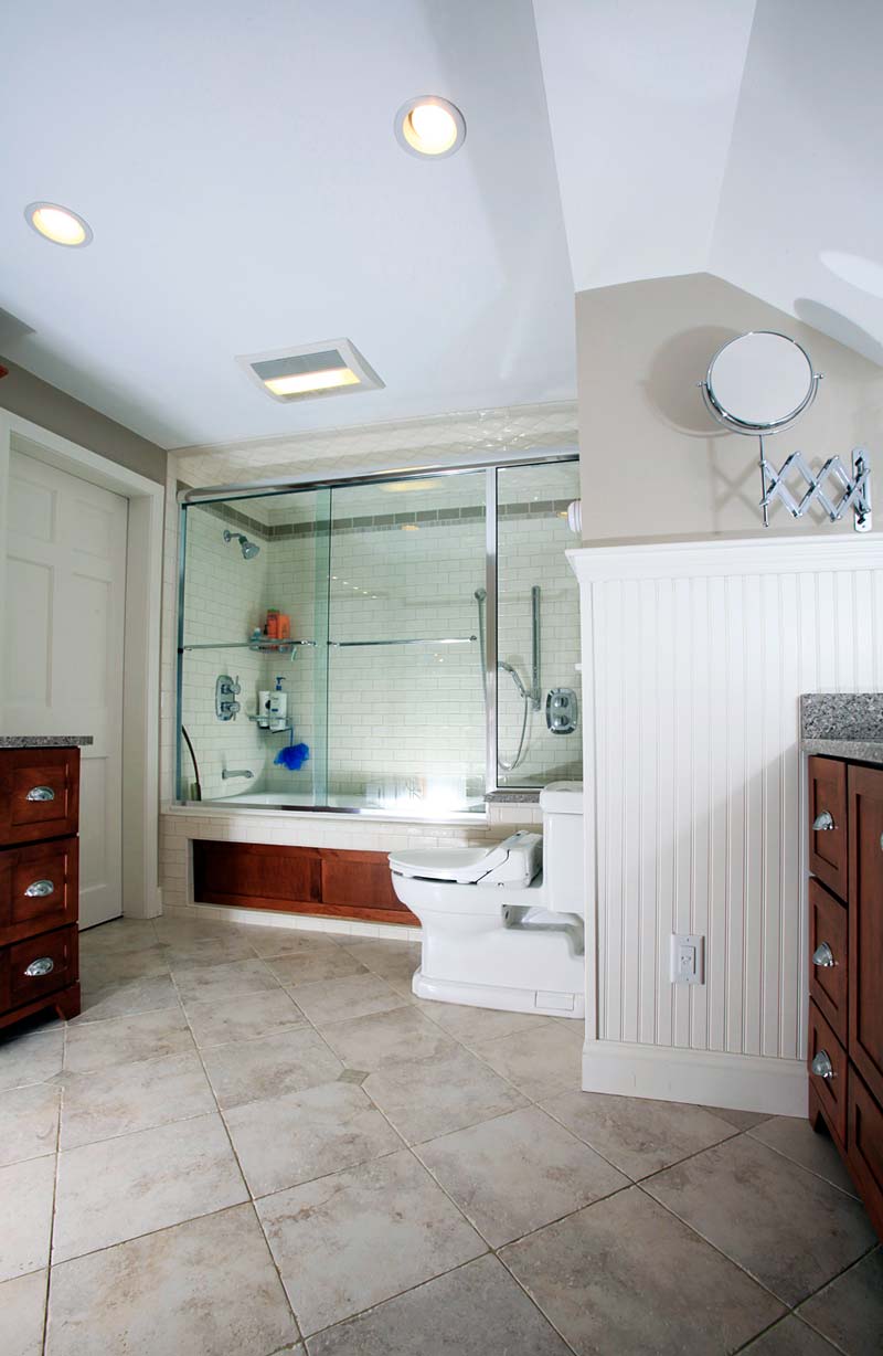 bathroom remodel in new hampshire with oakwood accents and cabinets