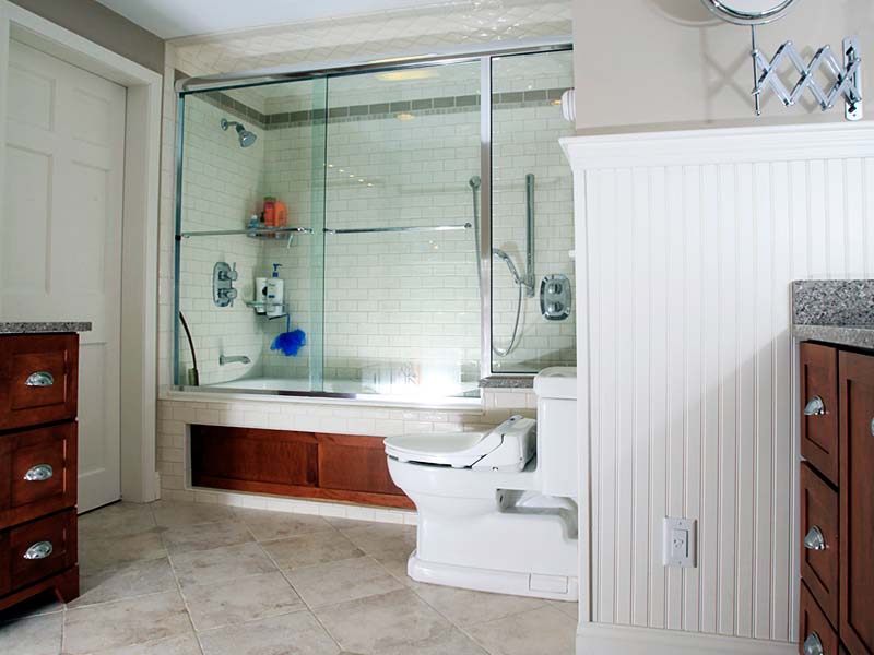 bathroom design in new hampshire with oakwood accents and cabinets