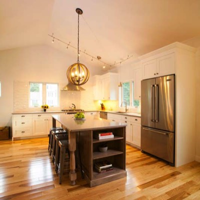 Completed kitchen remodel with vaulted ceilings and island with seating