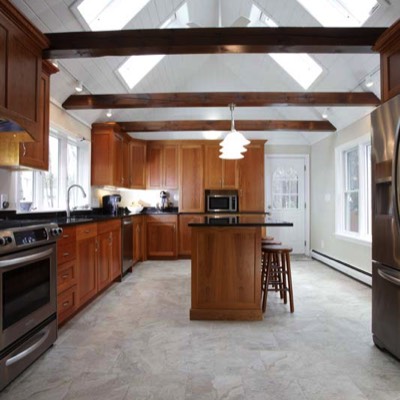 Well-lit kitchen with beams