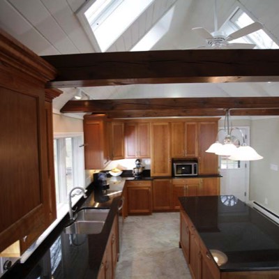 View of kitchen remodel with skylights in vaulted ceiling