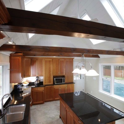 Wood ceiling beam detailing in kitchen renovation