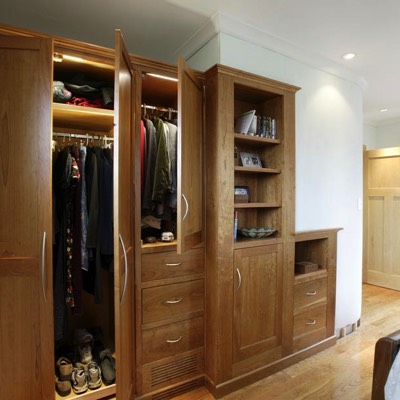 Custom wardrobe with wood cabinet doors and open-shelving