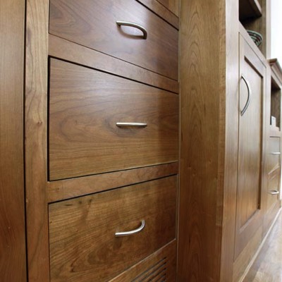 Close-up of wooden drawers built-in wardrobe