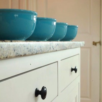 Four blue bowls on counter