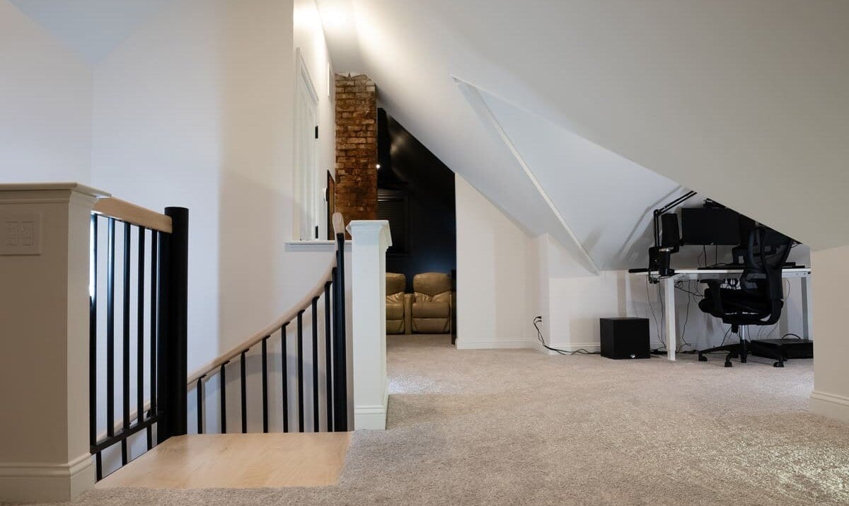 Top of curved staircase to finished attic with office space in Portsmouth remodel by Oxland Builders Top of curved staircase to finished attic with office space in Portsmouth remodel by Oxland Builders