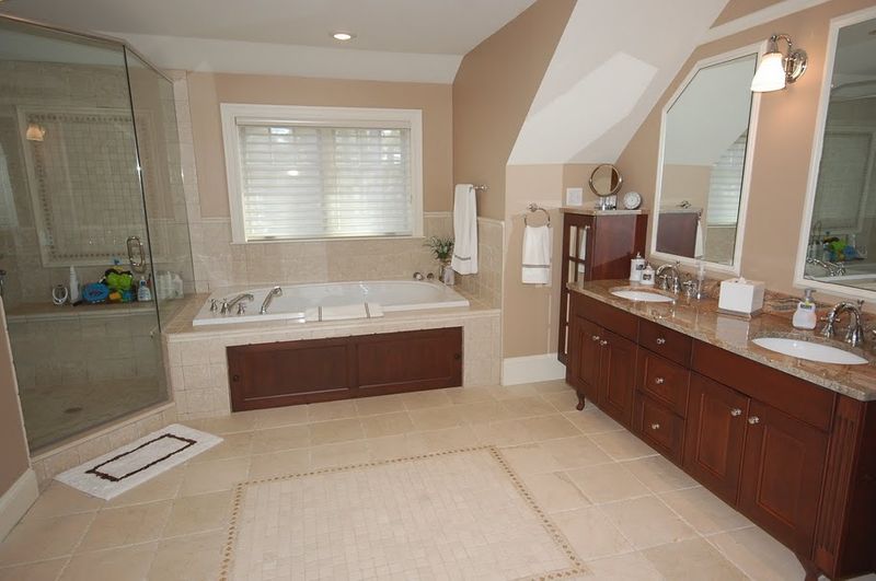 Bathroom remodel with glass paned shower and under mount jacuzzi tub