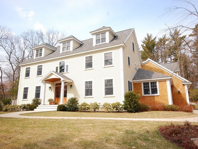 Custom home front yard view by Oxland Builders